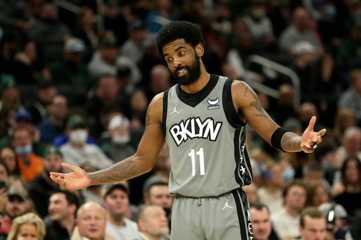 Kyrie Irving of the Brooklyn Nets reacts to a call during the second half of a game against the Milwaukee Bucks at Fiserv Forum in Milwaukee, February 26, 2022